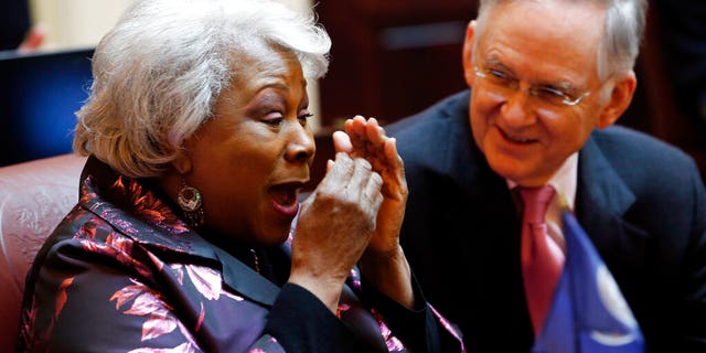 Virginia's State Senate majority leader, Thomas Norment, R-James City County, shares a laugh with Sen. Louise Lucas, D-Portsmouth, during a Senate session in Richmond on Thursday. (AP Photo/Steve Helber)