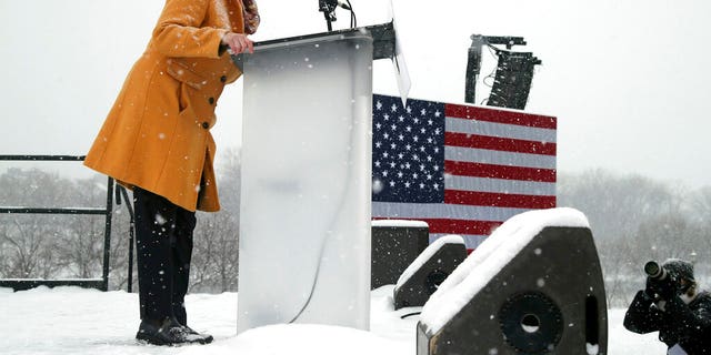 Democratic Sen. Amy Klobuchar addresses a snowy rally where she announced she is entering the race for president Sunday, Feb. 10, 2019, at Boom Island Park in Minneapolis. (AP Photo/Jim Mone)