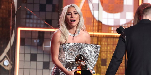 Lady Gaga reacts before accepting the award for best pop duo or group performance for "Shallow" at the 61st annual Grammy Awards on Sunday, Feb. 10, 2019, in Los Angeles.