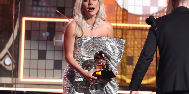 Lady Gaga reacts before accepting the award for best pop duo or group performance for "Shallow" at the 61st annual Grammy Awards on Sunday, Feb. 10, 2019, in Los Angeles.