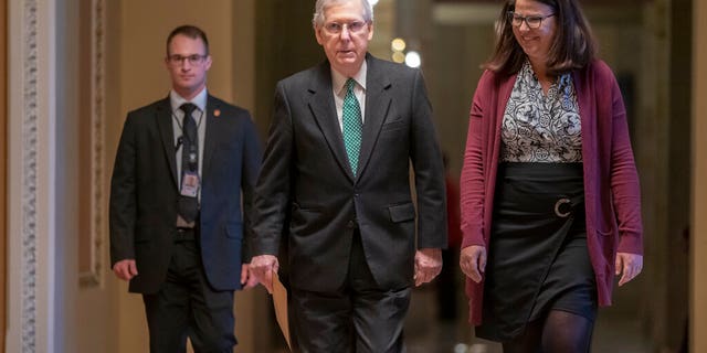 Senate Majority Leader Mitch McConnell, R-Ky., walks to the chamber on the morning after House and Senate negotiators worked out a border security compromise hoping to avoid another government shutdown, at the Capitol in in Washington, Tuesday, Feb. 12, 2019. (AP Photo/J. Scott Applewhite)