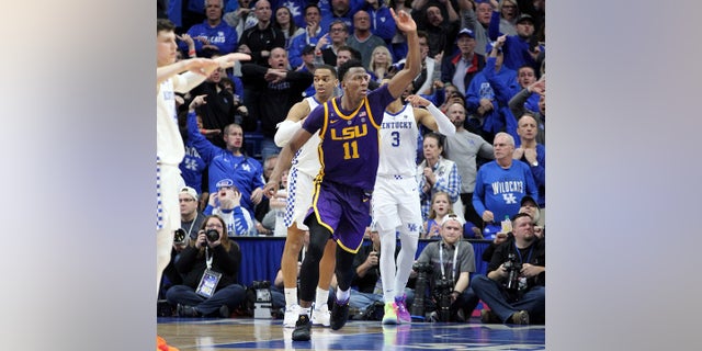 LSU's Kavell Bigby-Williams (11) celebrates after tipping in the game winning shot against Kentucky after an NCAA college basketball game in Lexington, Ky., Tuesday, Feb. 12, 2019. LSU won 73-71. (AP Photo/James Crisp)