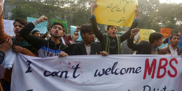 Pakistani protesters rally to condemn a visit of Saudi Arabia's Crown Prince to Pakistan, in Lahore, Pakistan, Friday, Feb. 15, 2019. Pakistan said Wednesday that Crown Prince Mohammed bin Salman will arrive in Islamabad later this week on an official visit that is expected to include the signing of agreements for billions of dollars of investment in Pakistan. (AP Photo/K.M. Chaudary)