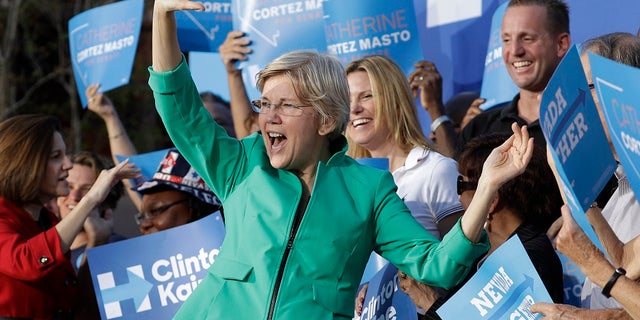FILE - Sen. Elizabeth Warren, D-Mass., was briefly heckled during a campaign rally in Georgia over her Native American ancestry claims. (AP Photo/John Locher, File)