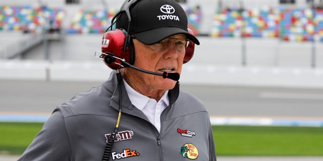 On this Sunday, February 10, 2019, the owner of the car, Joe Gibbs, wanders in the pits during qualifying for the Daytona 500 motor racing at Daytona International Speedway, in Daytona Beach, Florida (Associated Press).