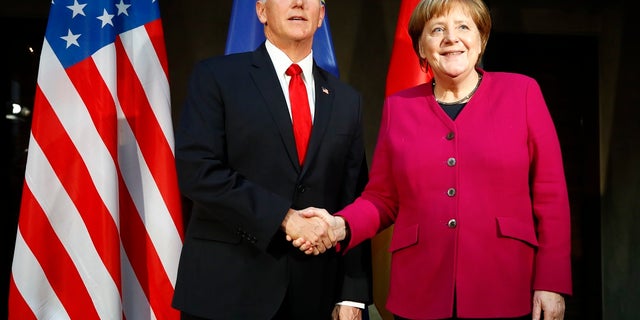 Vice President Mike Pence and German Chancellor Angela Merkel meet at the Munich Security Conference in Munich, Germany, Feb. 16, 2019. (Associated Press)
