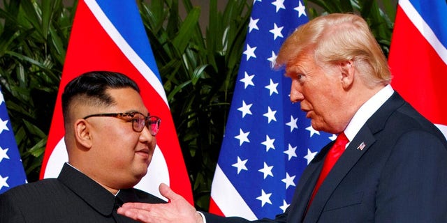 Kim Jong Un and President Trump are seen during their summit in Singapore in June 2018. (Associated Press)