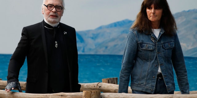 Virginie Viard and Karl Lagerfeld pose after the presentation of Chanel Spring/Summer 2019 ready-to-wear fashion collection on Oct.2, 2018. (AP Photo/Christophe Ena, File)