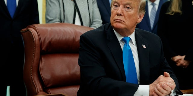 President Trump regularly mocks The New York Times, but the paper helped confirm his claim that tape is used to silence women crossing the border. (AP Photo/ Evan Vucci)