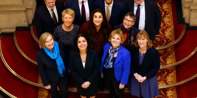 Eleven British politicians who have joined new political party 'The Independent Group' pose for a photograph after a press conference in Westminster in London, Wednesday, Feb. 20, 2019.
