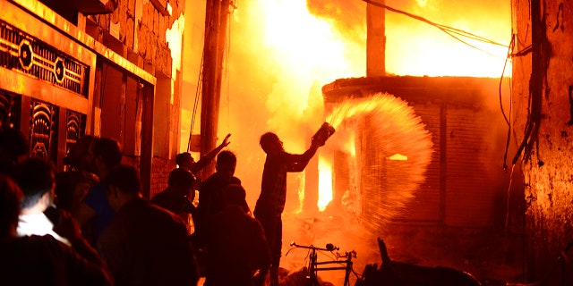 Officials said firefighters struggled to reach the area because of heavy traffic and narrow alleys that were busy when the fire started.