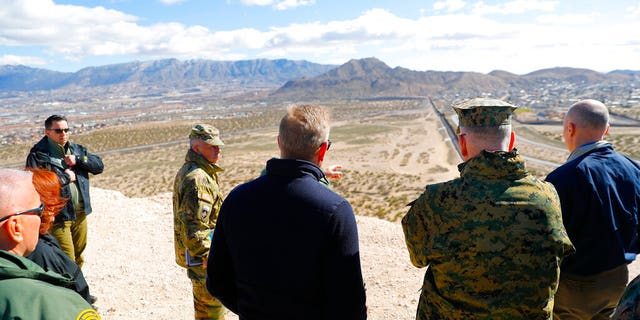 Acting Secretary of Defense Patrick Shanahan, center, and Joint Chiefs Chairman Gen. Joseph Dunford, second from the right, during a tour of the U.S.-Mexico border at Santa Teresa Station in Sunland Park, N.M., on Saturday. (AP Photo/Pablo Martinez Monsivais)