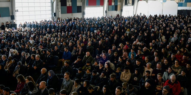 Family members, friends and members of the community attend the funeral for the seven Syrian refugee Barho siblings in Halifax, Nova Scotia, Saturday, Feb. 23, 2019. The siblings, who died in a house fire earlier in the week, are survived by their parents. (Darren Calabrese/The Canadian Press via AP)
