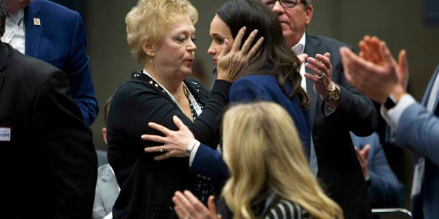 Jessica Patterson, right, shares a moment with her mother Julie Millan, after being nominated for chair of California Republican Party during their convention in Sacramento, Calif., Saturday, Feb. 23, 2019. (AP Photo/Steve Yeater)
