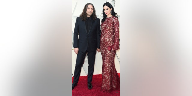 Krysten Ritter, right, and Adam Granduciel arrive at the Oscars on Sunday, Feb. 24, 2019, at the Dolby Theatre in Los Angeles. (Photo by Jordan Strauss/Invision/AP)