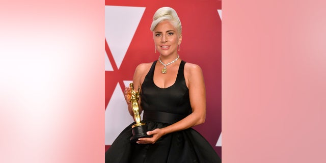 Lady Gaga, winner of the award for best original song for "Shallow" from "A Star Is Born", poses in the press room at the Oscars on Sunday, Feb. 24, 2019, at the Dolby Theatre in Los Angeles. (Photo by Jordan Strauss/Invision/AP)