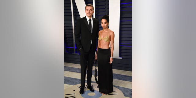 Zoe Kravitz and Karl Glusman arrive at the 2019 Vanity Fair Oscars Party.