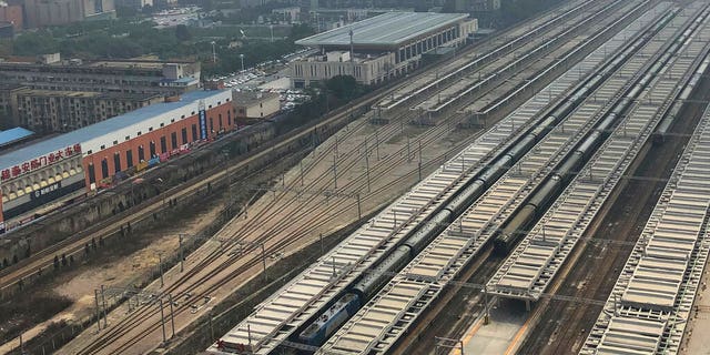 A train, center, similar to ones seen during previous visits to China by North Korean leader Kim Jong Un is seen at Changsha station in central China's Hunan province, Monday.