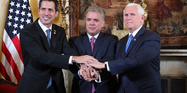 Venezuela's self-proclaimed interim president Juan Guaido, Colombia's President Ivan Duque and Vice President Mike Pence, pose for a photo after a meeting of the Lima Group concerning Venezuela at the Foreign Ministry in Bogota, Colombia, Monday, Feb. 25, 2019. Pence's appearance before the Lima Group comes two days after a U.S.-backed effort to deliver humanitarian across the border from Colombia ended in violence. (AP Photo/Martin Mejia)