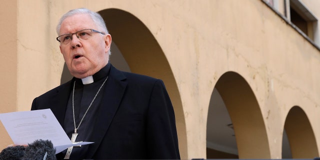Brisbane's Archbishop Mark Coleridge reads a statement to the media on the conviction of Australian Cardinal George Pell for molesting two choir boys in the 1970s, in Rome, Tuesday, Feb. 26, 2019. The most senior Catholic cleric ever charged with child sex abuse has been convicted of molesting two choirboys moments after celebrating Mass, dealing a new blow to the Catholic hierarchy's credibility after a year of global revelations of abuse and cover-up. (AP Photo/Alessandra Tarantino)