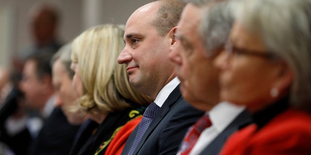 Matt Maddox, center, CEO of Wynn Resorts Ltd., attends a meeting of the Nevada Gaming Commission, Tuesday, Feb. 26, 2019, in Las Vegas.