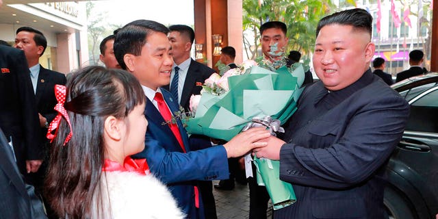 In this Tuesday photo provided by the North Korean government, North Korean leader Kim Jong Un, right, is welcomed on his arrival at the Melia Hotel in Hanoi, Vietnam. The content of this image is as provided and cannot be independently verified. Korean language watermark on image as provided by source reads: "KCNA" which is the abbreviation for Korean Central News Agency. (Korean Central News Agency/Korea News Service via AP)