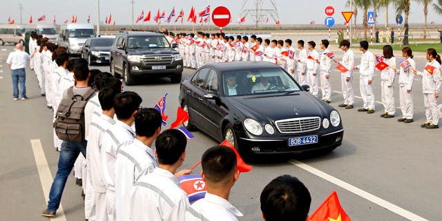 Students of Vinfast Training Centre holding flags of Vietnam and North Korea greet as the car carrying North Korean ruling party senior leader Ri Su Yong arrives at VinFast, automotive startup manufacturer in Hai Phong, Vietnam Wednesday, Feb. 27, 2019.