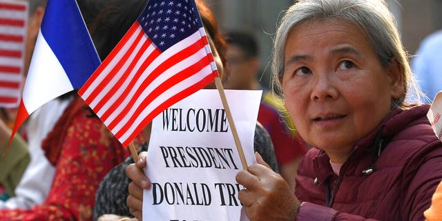 People gather near the area where U.S. President Donald Trump and North Korean leader Kim Jong Un will meet for dinner in Hanoi, Vietnam, Wednesday, Feb. 27, 2019. Trump and Kim will likely be all smiles as they shake hands in Hanoi at a meeting meant to put flesh on what many critics call their frustratingly vague first summit in Singapore. (AP Photo/Susan Walsh)
