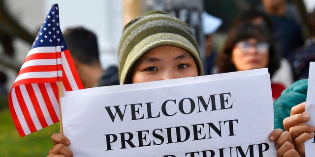 People gather near the area where U.S. President Donald Trump and North Korean leader Kim Jong Un will meet for dinner in Hanoi, Vietnam, Wednesday.