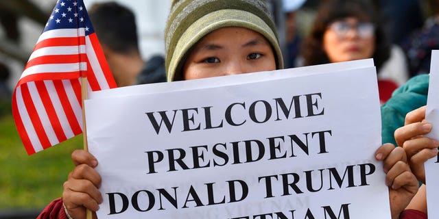 People gather near the area where U.S. President Donald Trump and North Korean leader Kim Jong Un will meet for dinner in Hanoi, Vietnam, Wednesday.
