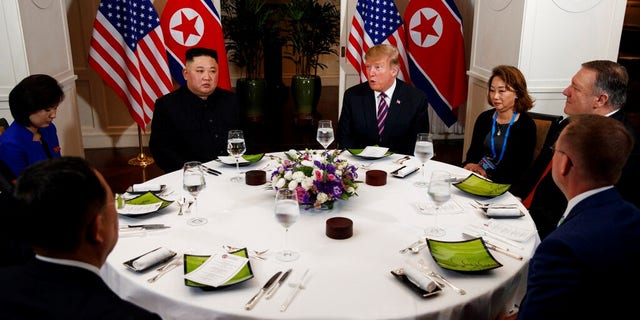 President Donald Trump speaks during a dinner with North Korean leader Kim Jong Un, Wednesday, Feb. 27, 2019, in Hanoi. Seated on right are acting White House Chief of Staff Mick Mulvaney, Secretary of State mike Pompeo and interpreter. Seated on left are North Korean Minister of Foreign Affairs, Ri Yong Ho and interpreter.Â 