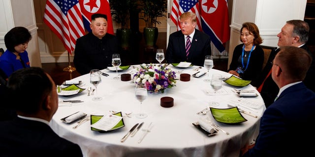 President Donald Trump speaks during a dinner with North Korean leader Kim Jong Un, Wednesday, Feb. 27, 2019, in Hanoi. Seated on right are acting White House Chief of Staff Mick Mulvaney, Secretary of State mike Pompeo and interpreter. Seated on left are North Korean Minister of Foreign Affairs, Ri Yong Ho and interpreter.