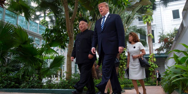 President Donald Trump and North Korean leader Kim Jong Un take a walk after their first meeting at the Sofitel Legend Metropole Hanoi hotel, Thursday, Feb. 28, 2019, in Hanoi. (AP Photo/Evan Vucci)