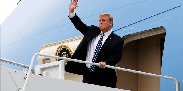 President Donald Trump waves as he boards Air Force One after a summit with North Korean leader Kim Jong Un, Thursday, Feb. 28, 2019, in Hanoi. (AP Photo/ Evan Vucci)