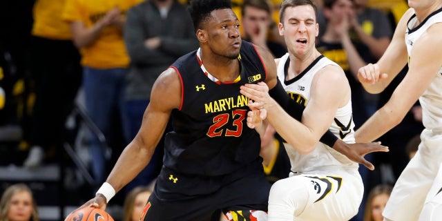 Maryland forward Bruno Fernando (23) drives past Iowa guard Connor McCaffery during the second half of an NCAA college basketball game Tuesday, Feb. 19, 2019, in Iowa City, Iowa.