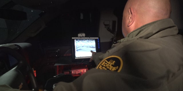 Border Patrol agent Cordero shows the infrared cameras agents use at night to detect movement across the border.