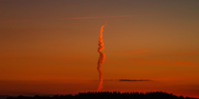 The mysterious cloud was spotted on Salisbury Plain, southern England, by a man walking his dogs.