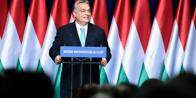 Hungarian Prime Minister Viktor Orban delivers his annual "State of Hungary" speech in Budapest, Hungary, Sunday, Feb. 10, 2019. The inscription reads: "For us Hungary is the first!"