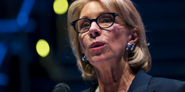 FILE - In this Sept. 17, 2018 file photo, Education Secretary Betsy DeVos speaks during a student town hall at National Constitution Center in Philadelphia. Democrats in Congress are accusing the Education Department of interfering with an investigation by the agency’s independent watchdog. Five lawmakers sent a letter to DeVos on Feb. 19, 2019, staying her deputy pressured the department’s inspector general on Jan. 3 to drop an internal investigation. (AP Photo/Matt Rourke, File)