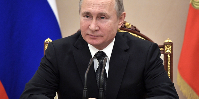 Russian President Vladimir Putin chairs a Security Council meeting in Moscow, Friday, Feb. 1, 2019.