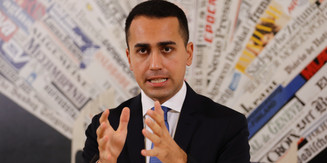 FILE - In this Nov.9, 2018 file photo, Italian deputy Premier and Labor Minister Luigi Di Maio talks to reporters during a press conference at the Foreign Press Association headquarters, in Rome. France is recalling its ambassador to Italy amid mounting tensions, after Di Maio met with French yellow vest protesters and offered to support their anti-government movement. (AP Photo/Andrew Medichini, File)