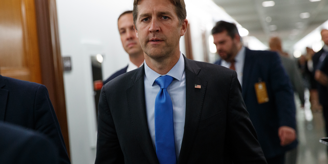 FILE - In this Sept. 27, 2018, file photo, Sen. Ben Sasse, R-Neb., walks on Capitol Hill in Washington. The Senate is pushing toward a vote on Republican legislation that would threaten prison for doctors who don’t try saving the life of infants born alive during abortions. “I want to ask each and every one of my colleagues whether or not we’re OK with infanticide,” the measure’s chief sponsor, Sasse, said Monday, Feb. 25, 2018, as debate began. (AP Photo/Carolyn Kaster, File)