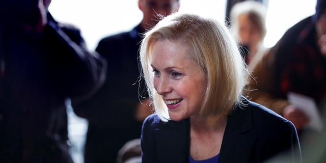 Sen. Kirsten Gillibrand, D-NY, smiles as she listens to a patron while visiting a coffee shop on Main Street in Concord, N.H., Friday, Feb. 15, 2019. Gillibrand visited New Hampshire as she explores a 2020 run for president. (AP Photo/Charles Krupa)