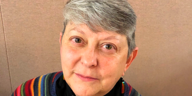 Lois McCullen Parr, 60, a United Methodist elder of Albion, Mich., poses for a picture at a national Methodist conference Monday, Feb. 25, at in St. Louis. Nearly 900 delegates will decide whether America's second-largest Protestant denomination will fracture due to divisions over same-sex marriage and the ordination of LGBT clergy. Parr identifies as bi-sexual and queer and said no one should be left out of God's love. (AP Photo/Jim Salter)