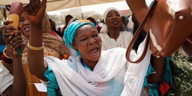 Nigerian women attend an inter-faith prayer rally organized by the Freedom and Justice Party in Abuja, Nigeria, Thursday Feb. 14, 2019. Incumbent President Muhammadu Buhari is to face opposition presidential candidate Atiku Abubakarin on Saturday, Feb. 16 in Nigeria's general election. (AP Photo/Jerome Delay)