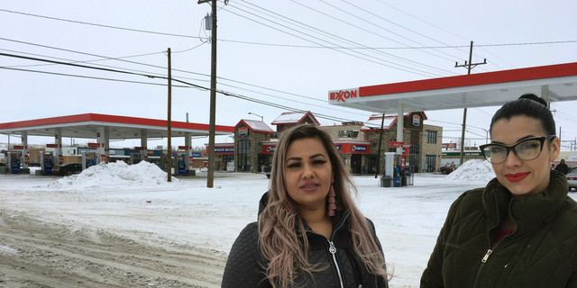 Martha Hernandez, left, and Ana Suda pose in front of a convenience store in Havre, Mont., where they say they were detained by a U.S Border Patrol agent for speaking Spanish last year.