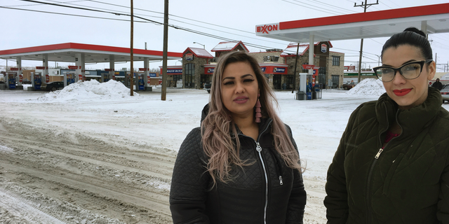 Martha Hernandez, left, and Ana Suda pose in front of a convenience store in Havre, Mont., where they say they were detained by a U.S Border Patrol agent for speaking Spanish last year.
