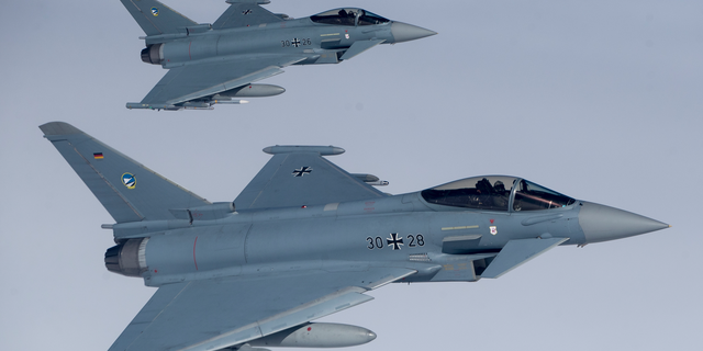 File -- In this Tuesday, April 25, 2017 photo German Eurofighter Typhoon fighter jets participate in NATO's Baltic Air Policing Mission operate in Lithuanian airspace during an air force exercise. Britain's top diplomat is demanding that Germany relax its ban on arms sales to Saudi Arabia because they are affecting UK sales of weapons to the oil-rich kingdom. (AP Photo/Mindaugas Kulbis, file)