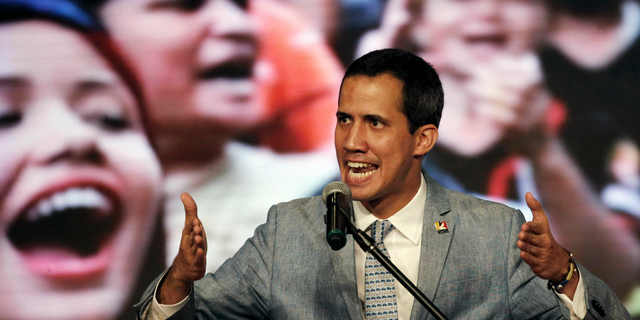 FILE - In this Feb. 8, 2019 file photo, Venezuela's self-proclaimed president Juan Guaido speaks during a meeting with university students at the Central University of Venezuela, in Caracas, Venezuela. Venezuelans abroad are already playing a key role in helping Guaido consolidate his position as the country's interim president. (AP Photo/Ariana Cubillos, File)