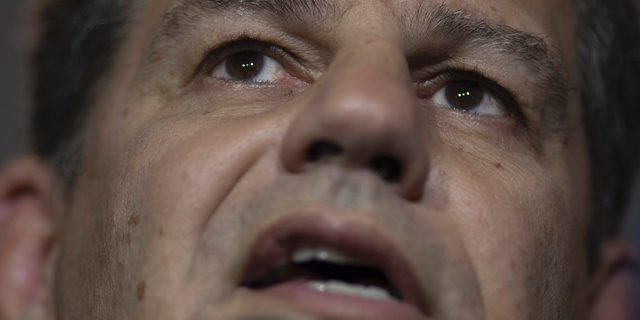 FILE - In this Oct.18, 2018 file photo, Gustavo Bebianno Rocha, then-president of the Social Liberal Party, speaks to journalists in Rio de Janeiro, Brazil. After days of uncertainty, Brazil's President Jair Bolsonaro officially fired Bebianno as his secretary general on Monday, Feb. 18, 2019, after a major Brazilian newspaper reported in Feb. 2019 that Bebianno was entangled in a corruption scandal involving phony candidates and the misuse of campaign funds. Bebianno denies any wrongdoing. (AP Photo/Leo Correa, File)